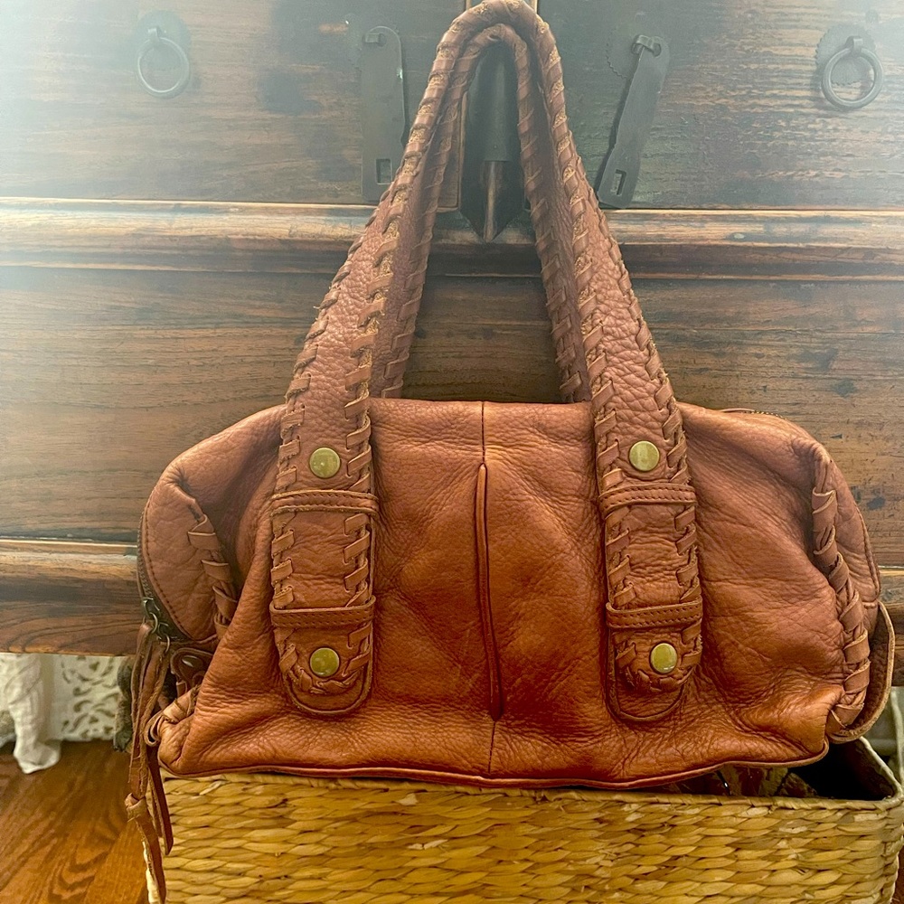 Great medium size brown leather bag.